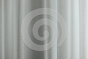 Linen curtains make folds. Linen fabrics in the interior. Soft textile background