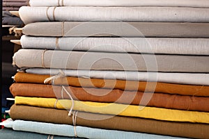 Linen fabric in rolls, fabric shop for interior and clothing, natural tailoring fabrics