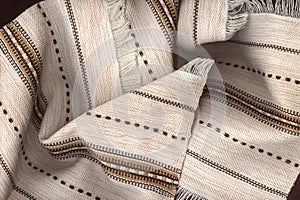 Light napkins made of natural fabric with a pattern and fringe