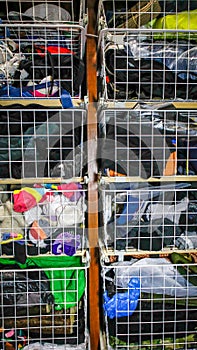 The linen is in the pull-out baskets in the closet, close-up