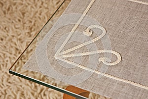 Linen tablecloth on a glass table