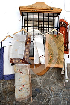 Linen tablecloths displayed outside a shop, Ronda, Spain.