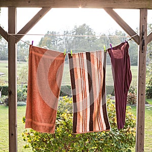 Linen towels weighs outside and dry on a rope; with the view