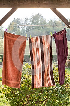 Linen towels weighs outside and dry on a rope; with the view