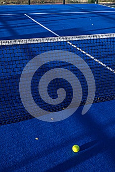 Lines, blue paddle tennis net and court field background with a yellow ball