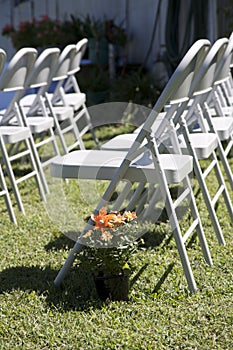 Lines of chairs for a country outdoor wedding