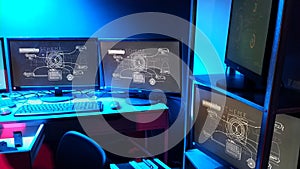 Lines of code running on computer screens in data center