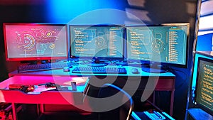 Lines of code running on computer screens in data center