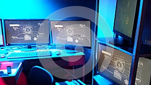 Lines of code running on computer screens in data center