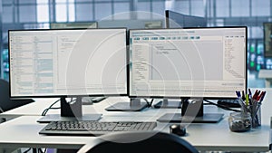Lines of code running on computer screens in data center