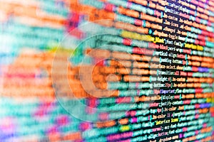 Lines of code of a software with several colors. Programming source code abstract screen of software developer. Programmer working