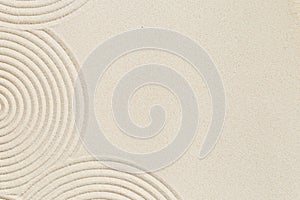 Lines drawing on sand, beautiful sandy texture. Spa background, concept for meditation and relaxation
