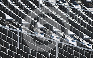 Lines of empty chairs with snow on the tribune of the Olympic Stadium in Barcelona, Spain