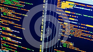 Lines of php coding on the screen. Orange code on dark blue background. Web developing