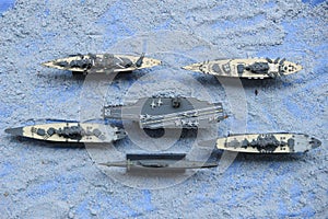 The lineup of miniature battleships consists of the enterprise carrier and others