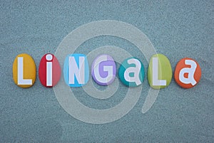 Lingala language, creative text composed with multi colored stone letters over green sand