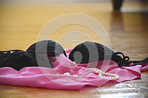 Lingerie and clothes thrown on the floor