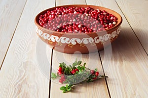 Lingonberry   cowberry , partridgeberry  on a wooden table. Top view