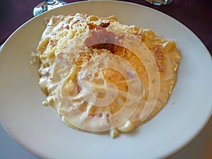 Linguine Carbonara served on a white plate