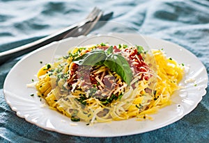 Linguine pasta with fresh tomato sauce, grated cheese and basil