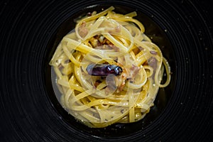 Linguine tossed in crispy bacon, egg, parmigiano and a light touch of chilli