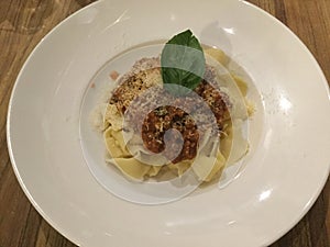 Linguini Bolognese with cheese . Top view