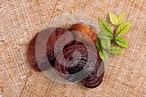 Lingzhi mushroom isolated on wood background