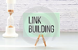 LINK BUILDING text written on a notebook with pen on chart
