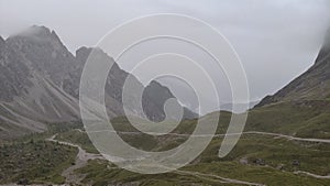 Link Dolomites in cloudy, nasty weather , Alps in Austria. Mountain paths for hiking and walking, rain and cold. Active traveler