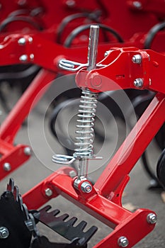 Linkage mechanism with a coiled spring