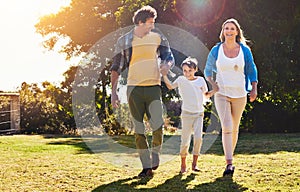 Linked by love. a happy family spending time together outdoors.