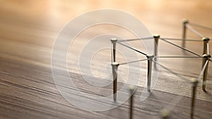 Linking entities. Network, networking, social media, internet communication abstract. Web of gold wires on rustic wood.
