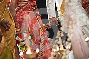 Linking pinky fingers at a Ceylonese Hindu wedding