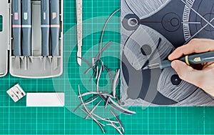 Lino cutting in art class close up.