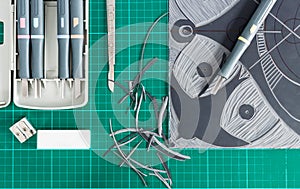 Lino cutting tools on table.