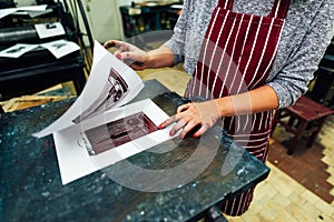 Linocut. manual printing on the machine photo