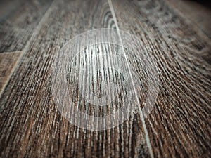 Linoleum flooring with embossed wood texture close-up