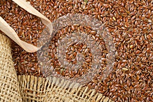 Linseed, flax seeds and wooden scoop