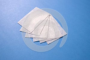 Lint-free wipes on blue background. Professional Nail Care Tools For Manicure. Varnish removal Small nail art and manicure busines