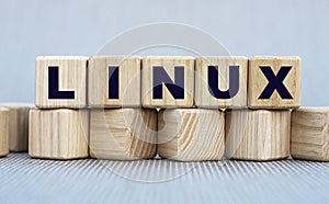 LINUX - word on wooden cubes on a beautiful gray background photo