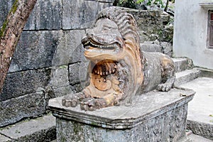 Lion ancient stone statue