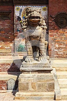 Lion guard in front of the royal palace in Lalitpur of Patan, Nepal photo