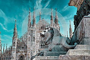 A Lion is guarding the Duomo di Milano Milan Cathedral in Italy. Milan Cathedral is the largest church in Italy and the third