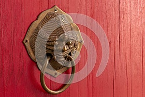 Lion Head Door Knob Closeup With Red Chinese Style Wooden Door