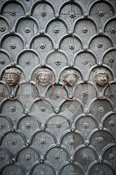 Lion Heads Cathedral Door Venice Italy photo