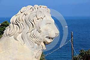 Lion marble sculpture. Park and the mountains near the Vorontsov Palace, Crimea.