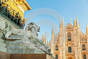 Lion marble statue near famous church Milan Cathedral Duomo di Milano. Panoramic view of top tourist attraction on piazza in Milan