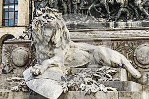 Lion on the pedestal of the monument to Victor Emmanuel II in Milan, Italy