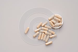 Vegetarian capsules laid on white table isolated photo