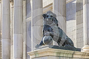 Lion sculpture by the Congress of Deputies - Congreso de Los Diputados Spanish Parliament, Palacio de las Cortes, Madrid photo